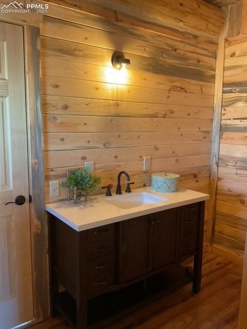 1906 Korlkoff Ln, Fort Garland, CO 81133 - bathroom with wooden walls and vanity