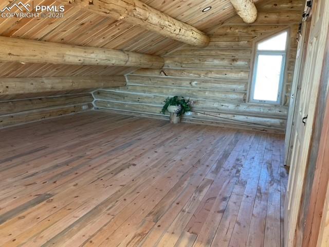 1906 Korlkoff Ln, Fort Garland, CO 81133 - bonus room with wood ceiling, rustic walls, vaulted ceiling with beams, and hardwood / wood-style floors
