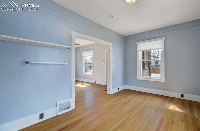 3010 W Kiowa St, Colorado Springs, CO 80904 - empty room featuring wood finished floors, baseboards, and visible vents