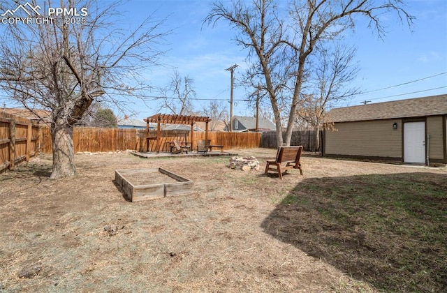 3010 W Kiowa St, Colorado Springs, CO 80904 - view of yard with a pergola, a fenced backyard, and an outbuilding