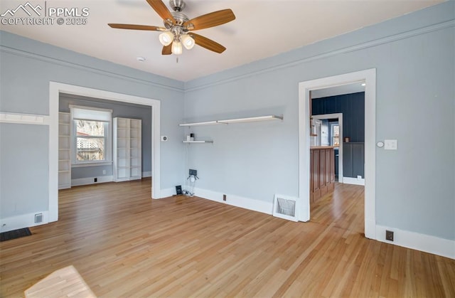 3010 W Kiowa St, Colorado Springs, CO 80904 - spare room with baseboards, a ceiling fan, visible vents, and light wood-type flooring