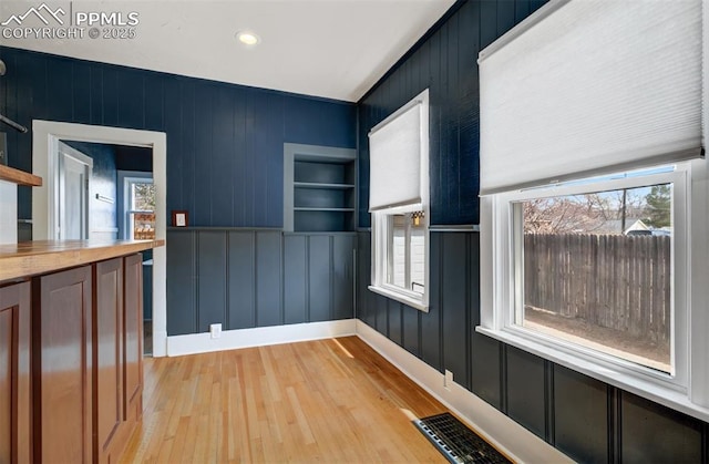 3010 W Kiowa St, Colorado Springs, CO 80904 - unfurnished dining area with baseboards, a wealth of natural light, visible vents, and light wood finished floors