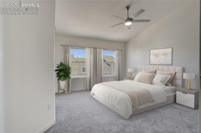 bedroom featuring baseboards, lofted ceiling, ceiling fan, and carpet