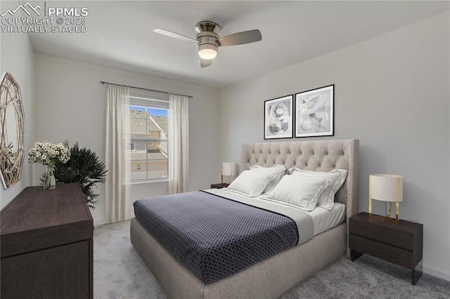 carpeted bedroom with baseboards and a ceiling fan