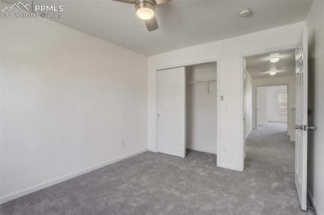 unfurnished bedroom featuring baseboards, a closet, carpet, and a ceiling fan