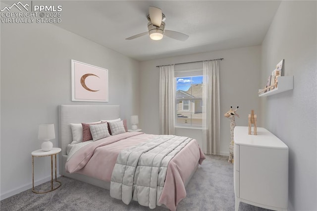 bedroom featuring baseboards, a ceiling fan, and light carpet