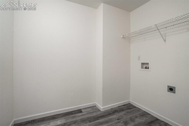 laundry area with dark wood-type flooring, baseboards, laundry area, and hookup for an electric dryer