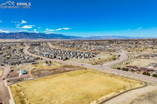 birds eye view of property with a residential view and a mountain view