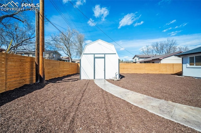 view of shed featuring a fenced backyard