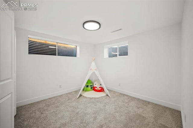 playroom featuring baseboards and carpet flooring
