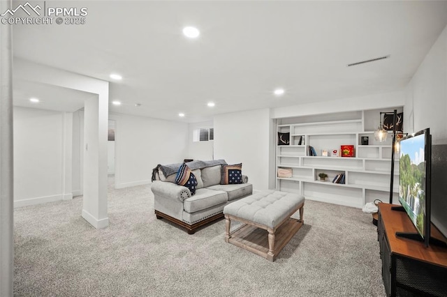 carpeted living room featuring baseboards, visible vents, and recessed lighting