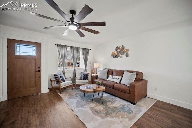 living room featuring a wealth of natural light, wood finished floors, and a ceiling fan