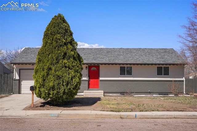 2118 S El Paso Ave, Colorado Springs, CO 80905 - view of front facade with fence, entry steps, a garage, brick siding, and driveway