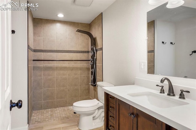 2118 S El Paso Ave, Colorado Springs, CO 80905 - bathroom featuring toilet, vanity, and tiled shower