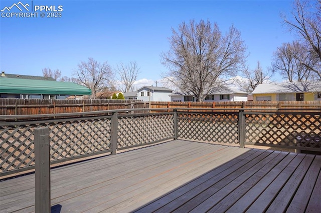 2118 S El Paso Ave, Colorado Springs, CO 80905 - wooden terrace with a fenced backyard and a residential view