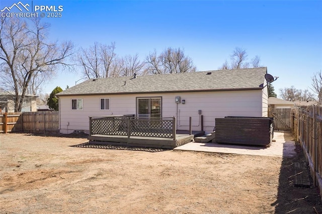2118 S El Paso Ave, Colorado Springs, CO 80905 - rear view of property featuring a fenced backyard, a shingled roof, and a wooden deck