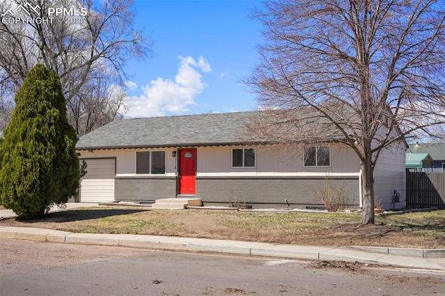 2118 S El Paso Ave, Colorado Springs, CO 80905 - ranch-style house featuring fence, entry steps, a garage, brick siding, and roof with shingles