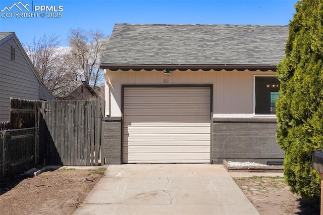 2118 S El Paso Ave, Colorado Springs, CO 80905 - garage featuring driveway and fence