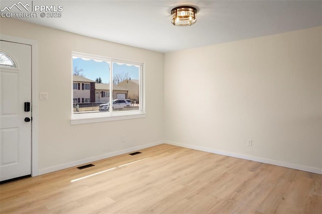 2118 S El Paso Ave, Colorado Springs, CO 80905 - foyer entrance with wood finished floors, baseboards, and visible vents