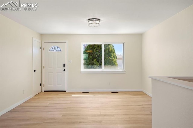 2118 S El Paso Ave, Colorado Springs, CO 80905 - entryway featuring baseboards, visible vents, and light wood-type flooring