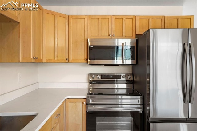 2118 S El Paso Ave, Colorado Springs, CO 80905 - kitchen featuring light countertops and stainless steel appliances