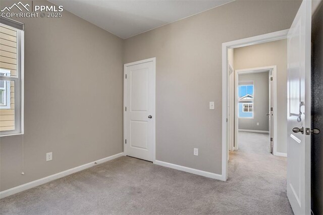 1341 Solitaire St, Colorado Springs, CO 80905 - unfurnished bedroom featuring carpet flooring and baseboards