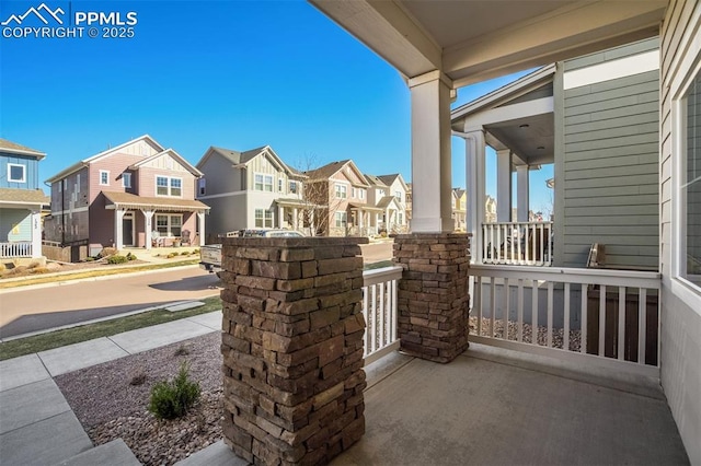 1341 Solitaire St, Colorado Springs, CO 80905 - view of patio with covered porch and a residential view