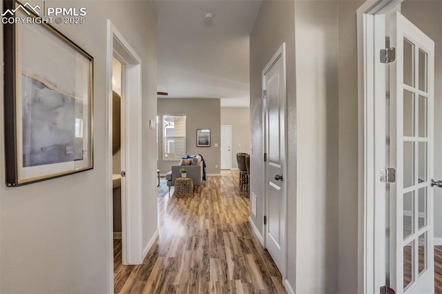 1341 Solitaire St, Colorado Springs, CO 80905 - hall featuring baseboards and wood finished floors