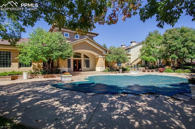 3815 Riviera Grv Unit 201, Colorado Springs, CO 80922 - view of pool featuring a covered pool, a patio, and french doors
