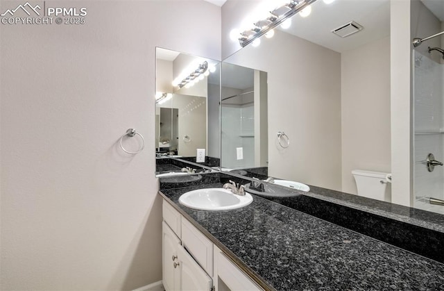 5865 Waterfall Loop, Manitou Springs, CO 80829 - bathroom with toilet, vanity, walk in shower, and visible vents