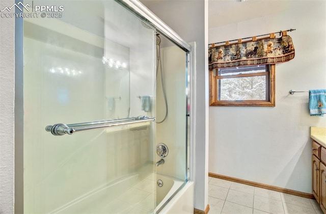 5865 Waterfall Loop, Manitou Springs, CO 80829 - bathroom with baseboards, tile patterned floors, bath / shower combo with glass door, and vanity