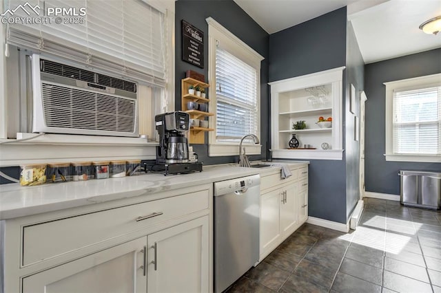 bar featuring stainless steel dishwasher, cooling unit, baseboards, and a sink