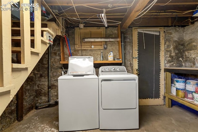 clothes washing area with washer and dryer and laundry area