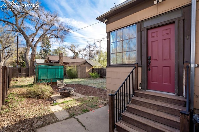 property entrance featuring fence