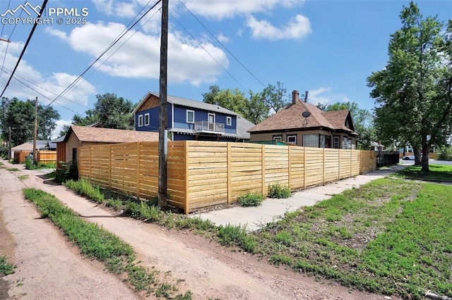 view of property exterior with fence