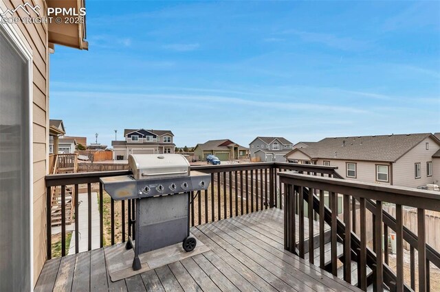 wooden terrace featuring a residential view