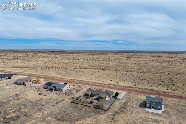aerial view featuring a rural view and a desert view