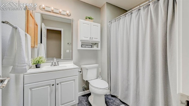 bathroom with toilet and vanity