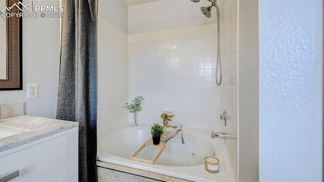 full bathroom with a combined bath / shower with jetted tub and vanity