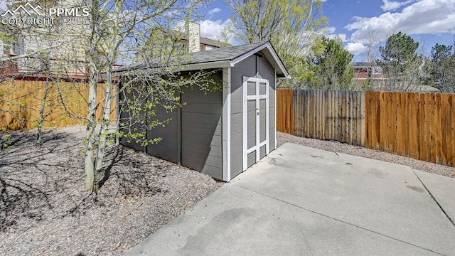 view of shed featuring a fenced backyard