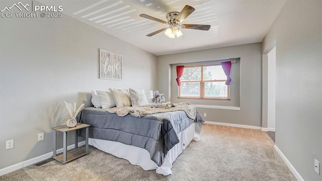 bedroom featuring a ceiling fan, baseboards, and carpet