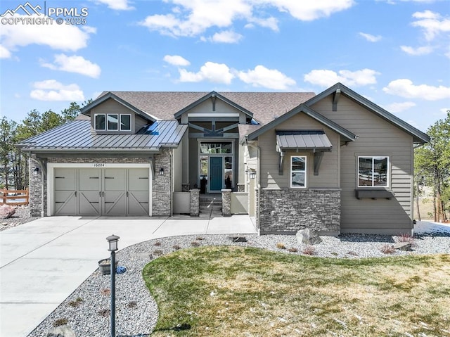 16224 Sunrise Glory Ln, Monument, CO 80132 - craftsman-style home featuring driveway, a front yard, stone siding, and metal roof
