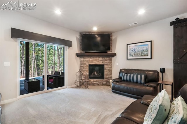 16224 Sunrise Glory Ln, Monument, CO 80132 - carpeted living room with recessed lighting, visible vents, a stone fireplace, and baseboards