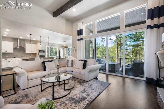 16224 Sunrise Glory Ln, Monument, CO 80132 - living area with recessed lighting, dark wood-type flooring, a towering ceiling, and beam ceiling