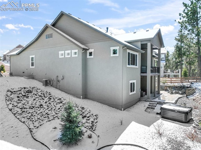 16224 Sunrise Glory Ln, Monument, CO 80132 - view of side of property featuring central AC unit, fence, a balcony, and stucco siding
