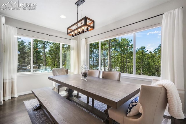 16224 Sunrise Glory Ln, Monument, CO 80132 - dining area featuring dark wood-type flooring, baseboards, recessed lighting, and an inviting chandelier