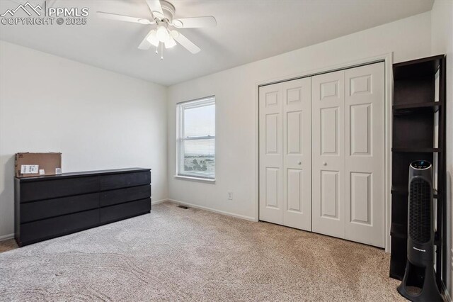 13255 Woodlake Rd, Elbert, CO 80106 - unfurnished bedroom with baseboards, carpet flooring, a closet, and ceiling fan
