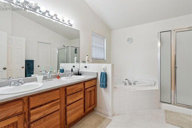 13255 Woodlake Rd, Elbert, CO 80106 - bathroom with double vanity, a stall shower, lofted ceiling, and a sink