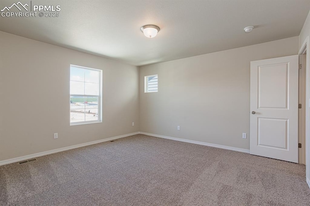 5229 Devers Ct, Colorado Springs, CO 80925 - empty room with baseboards, visible vents, and carpet flooring