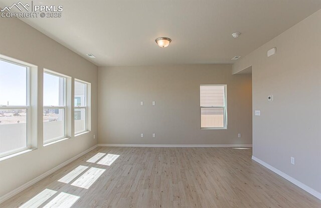 5229 Devers Ct, Colorado Springs, CO 80925 - unfurnished room with baseboards, visible vents, and light wood-style flooring